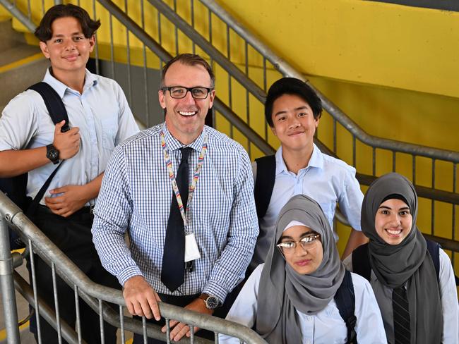 Wisdom College principal Damien Barry with students (from left) Wassin Shalaby, Hai Train, Hameedah Buksh (front) and Mariam Herrmann. Picture: Lyndon Mechielsen