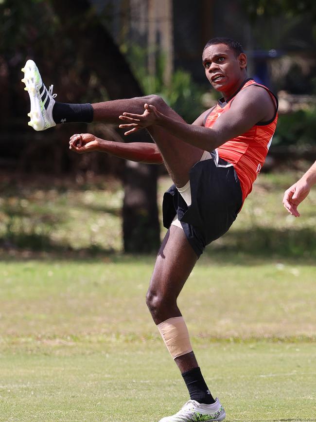 Irving Mosquito kicking for goal at Essendon training. Picture: Michael Klein