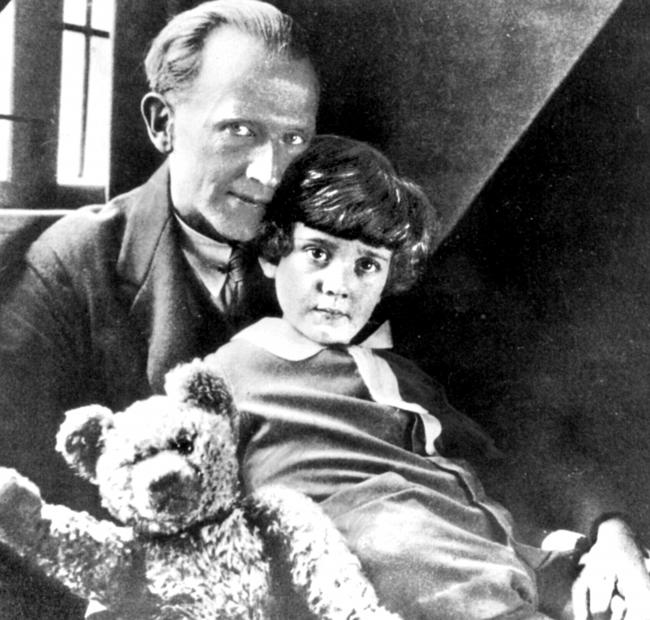 Author A.A. Milne with his son Christopher Robin and Winnie, his toy bear, at Cotchford Farm, Hartfield, in 1926.