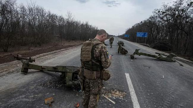 Ukrainian troops check out destroyed Russian military equipment following a battle in the town of Trostyanets in the Sumy region. Picture: Armed Forces of Ukraine via AFP