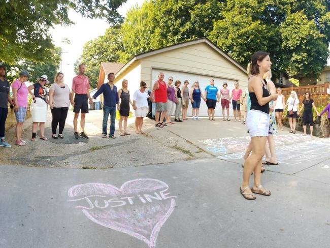 Local residents hold a vigil at the scene of the shooting. Picture: Jeff Wagner/WCCO/Twitter