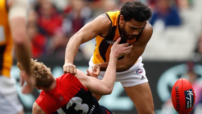 Cyril Rioli and Clayton Oliver collide. (Photo by Michael Willson/AFL Media/Getty Images)