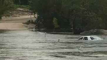 Most years vehicles are washed off the causeway trying to cross the Archer River in flood.