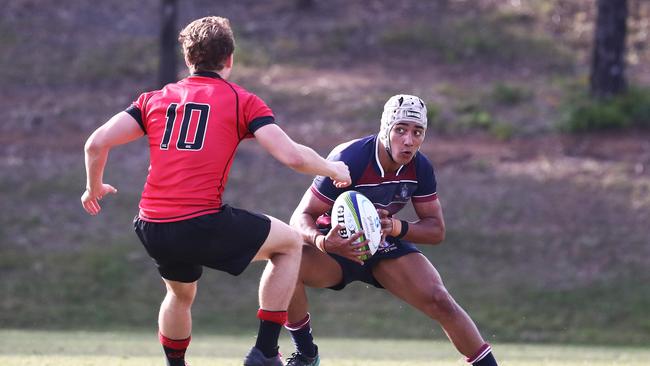 Syrus Schmidt of The Southport School in action against Gregory Terrace during their GPS First XV Rugby Match at Southport. Photograph : Jason O'Brien