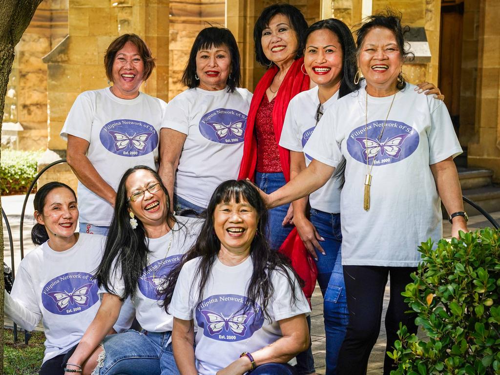 Aida Garcia (in red sequins) is a retired lawyer and migration agent who delivered groceries with helpers (l-r) Cora Budnik, clemen Tomakin, Marilyn Linn, Ruzelle Rewak, Luz Pore-Shields, Antonette McColl and Annie Baker. Picture: Mike Burton