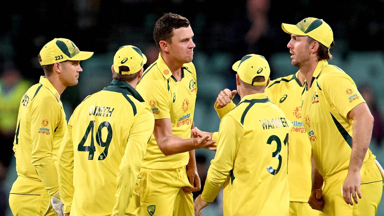 Hazlewood celebrates a wicket with teammates on the way to victory. Picture: AFP Images