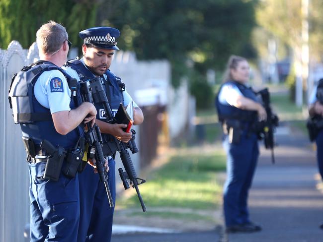 Armed police maintain a presence outside the Masijd Ayesha Mosque in Manurewa. Picture: Getty