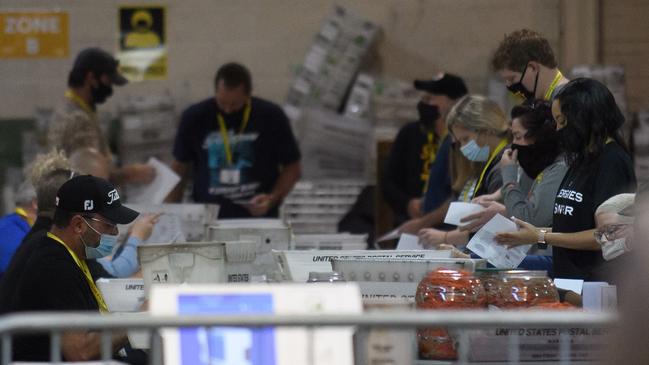 Election employees organise ballots at the Allegheny County elections warehouse in Pittsburgh, Pennsylvania, at the weekend. Picture: Getty Images