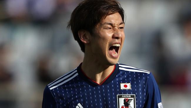 ABU DHABI, UNITED ARAB EMIRATES - JANUARY 09: Yuya Osako of Japan reacts after a missed chance during the AFC Asian Cup Group F match between Japan and Turkmenistan at Al Nahyan Stadium on January 09, 2019 in Abu Dhabi, United Arab Emirates. (Photo by Francois Nel/Getty Images)