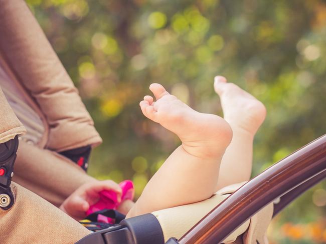 istock  pram and stroller. child is lie in a carriage