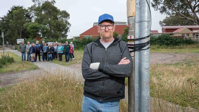 Glenn Lorenz with other concerned locals on the site of the proposed two story childcare centre next to Drysdale Primary school on Clifton Springs Rd. Picture: Brad Fleet