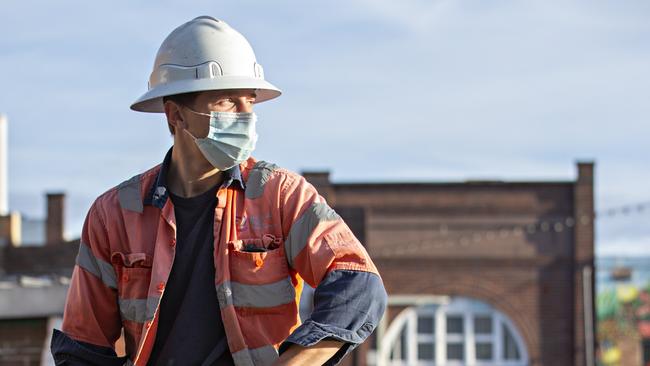 Labourer Brenten McGee working on site in Merrylands, in Sydney’s west. Picture: Adam Yip