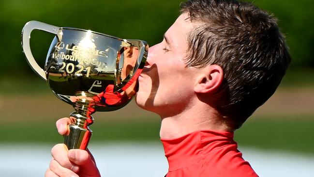 James McDonald kisses the Melbourne Cup trophy after winning aboard Verry Elleegant. Picture: Getty Images