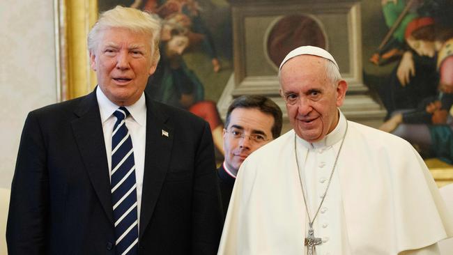 Pope Francis (R) stands with US President Donald Trump during a private audience at the Vatican on May 24, 2017. Picture: AFP.