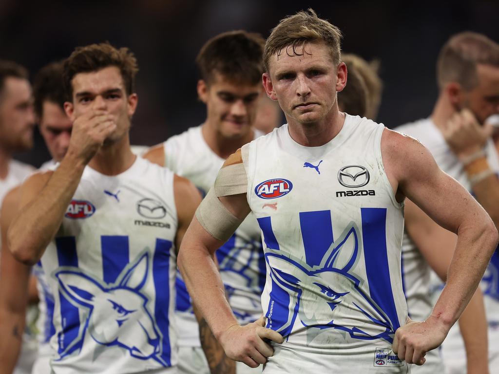 Jack Ziebell leads the Kangaroos from the field after being defeated by the Fremantle Dockers and the North Melbourne Kangaroos at Optus Stadium on May 06, 2022 in Perth, Australia. (Photo by Paul Kane/Getty Images)