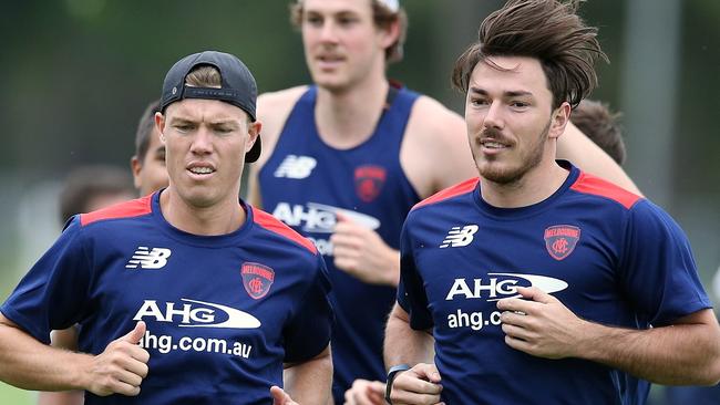 Former Bombers Jake Melksham and Michael Hibberd hit the track. Picture: Wayne Ludbey