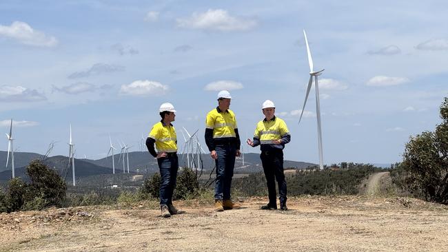 Tattarang chief executive John Hartman, Squadron Energy CEO Rob Wheals and Stanwell CEO Michael O’Rourke at the Clarke Creek Wind Farm. Photo: Charlie Peel