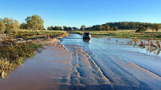 The driver of this car drove around road closed signs last night to take on Cox's creek in flood. Picture: NSW SES Tambar Springs