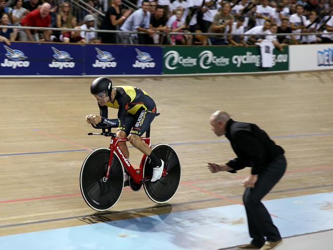 Jack Bobridge attempts to break the hour world record in Melbourne as coach Tim Decker urges him on. Picture: Ian Currie.