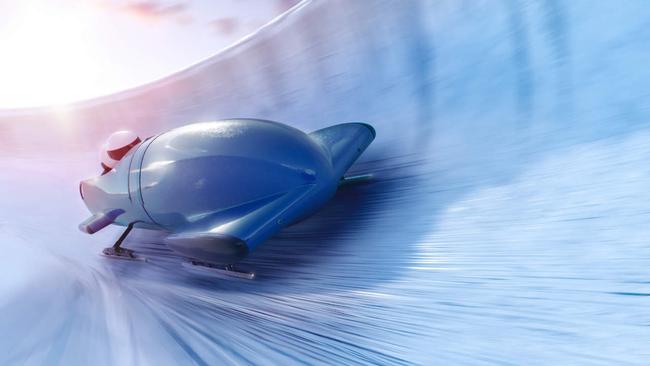 Bobsleigh team is riding on a high speed in a turn - full 3D