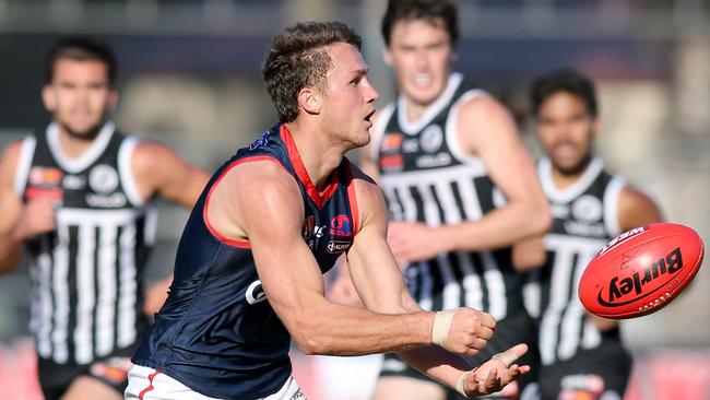 Norwood's Peter Bampton fires off a handball against Port Adelaide. Picture: AAP Image/Dean Martin