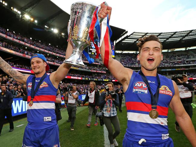 Western Bulldogs Clay Smith and Luke Dahlhaus celebrate after the 2016 AFL Grand Final match between the Western Bulldogs and the Sydney Swans at the Melbourne Cricket Ground (MCG), Melbourne, Australia on October 1, 2016. Picture: Mark Stewart