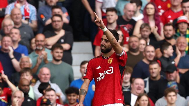 Man U captain Bruno Fernandes salutes fans. Photo by Darren Staples / AFP