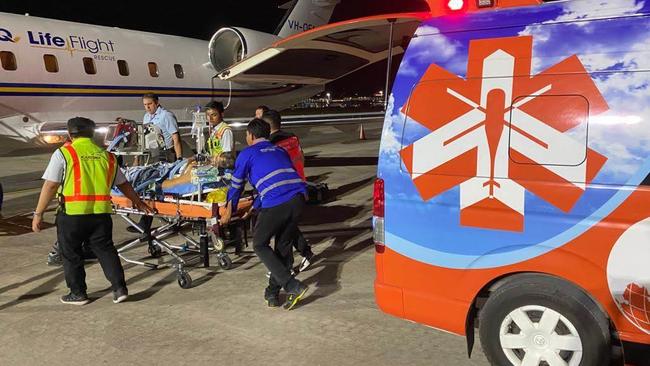 A critically ill Mark Richardson being loaded on LifeFlight's Air Ambulance Jet in Bali. The Australian surfing identity was flown from Bali to Darwin following complications from a stomach ulcer which left him with severe internal bleeding. Picture: Supplied