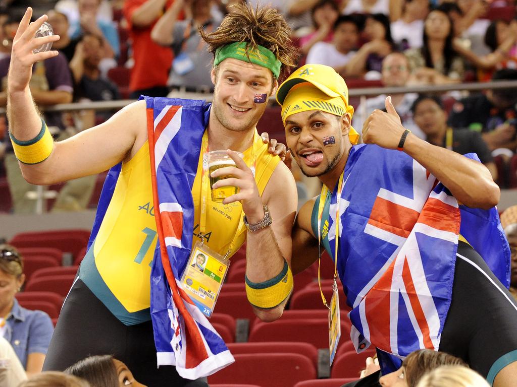 Boomers Mark Worthington and Patty Mills support the Opals during their gold medal match at the Beijing 2008 Olympics, after their own exit in the quarter-finals. Picture: Colleen Petch