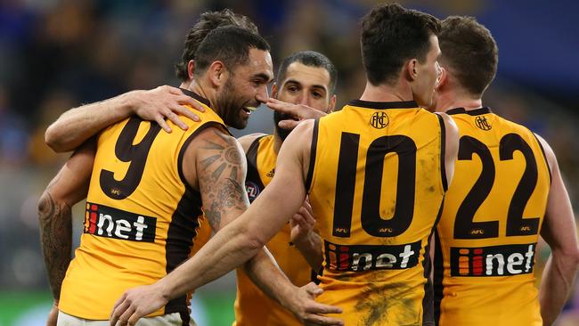 Hawthorn players celebrate a Shaun Burgoyne goal on Saturday night. Picture: Paul Kane/Getty Images.