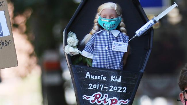 One of the signs on display at the Melbourne rally. Picture: NCA NewsWire / David Crosling