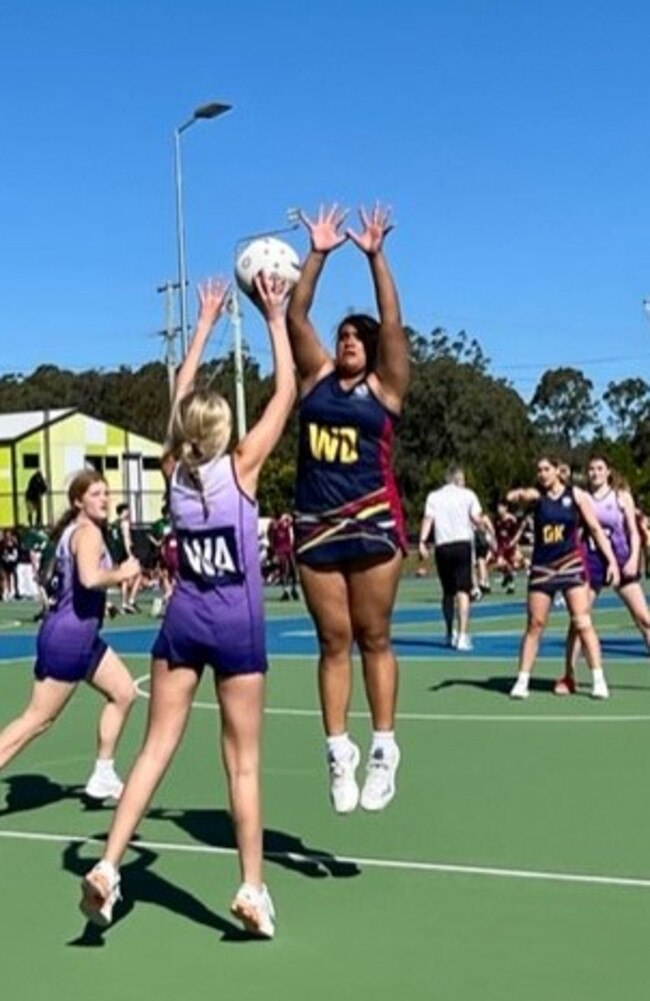 Tiana Afoa (defence) in action during the QGSSSA season.