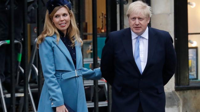 Prime Minister Boris Johnson, right, with partner Carrie Symonds in London on April 12. Picture: AFP