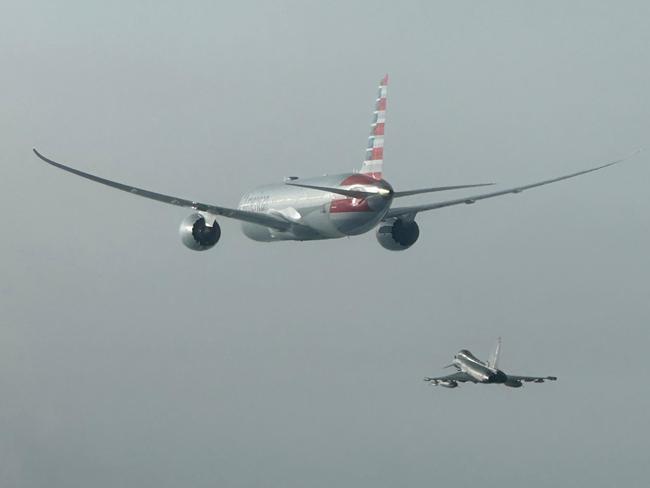 The American Airlines flight and fighter jet beside it.