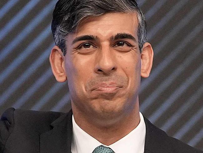 (FILES) Britain's Prime Minister and Conservative Party leader Rishi Sunak acknowledges the audience during a Sky News election event in Grimsby, northeast England, on June 12, 2024. Rishi Sunak is seeking his own public mandate at next month's general election, on July 4, 2024, having been installed as Conservative leader and UK prime minister by his own colleagues in parliament. The 44-year-old former financier was tasked with stabilising the UK economy, and his own notoriously fractious party, when he succeeded Liz Truss in October 2022 after her 49-day premiership imploded. (Photo by Stefan Rousseau / POOL / AFP)