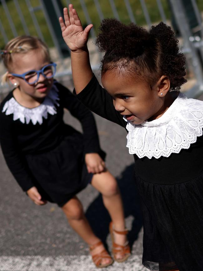 Little girls wait in line dressed as Ruth Bader Ginsburg to view the casket of the Associate Justice. Picture: AFP