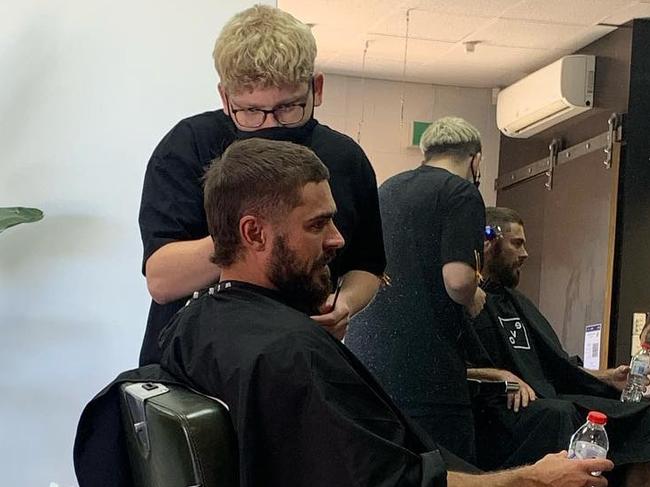 Movie star Zac Efron getting his hair cut at Attaboy Barbers in Kent Town. Picture Supplied/Facebook,