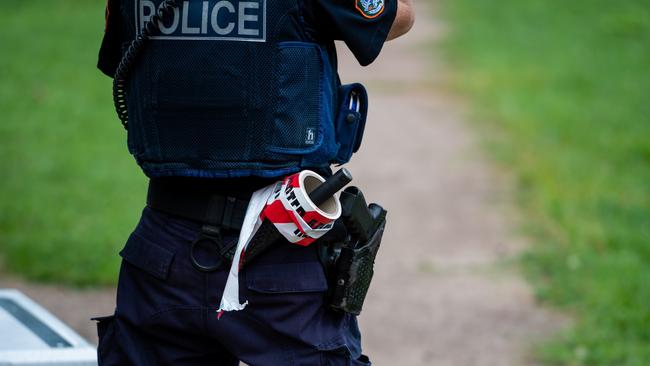 Police conduct their investigations near the scene of the incident in Jingili. Picture: Che Chorley