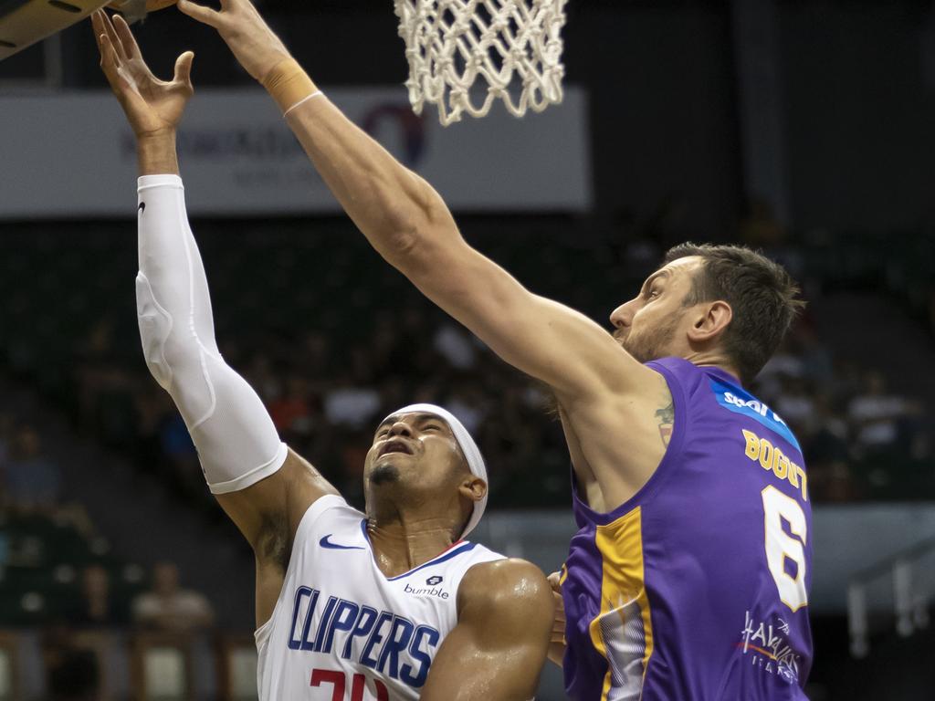 Los Angeles Clippers forward Tobias Harris has his shot blocked by Bogut.