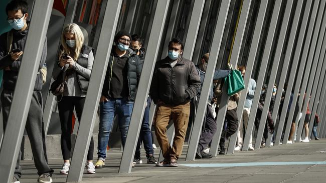 People line up at a vaccine hub in Melbourne. Picture: Darrian Traynor/Getty Images