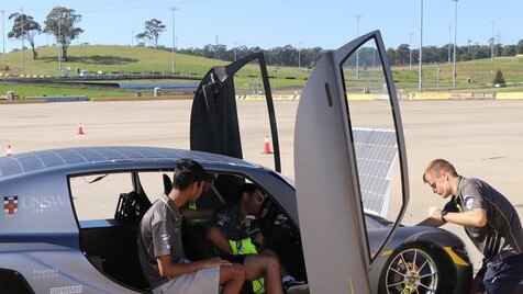 The Sunswift 7 team tinker with the solar powered electric race car. Picture: Sunswift