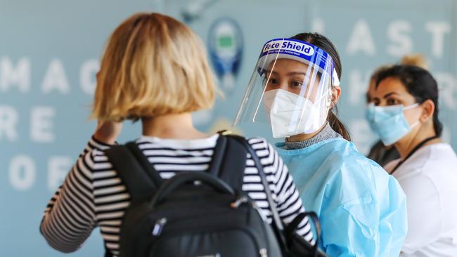 Passengers take COVID-19 tests at Melbourne Airport. Picture: Herald Sun / Tim Carrafa