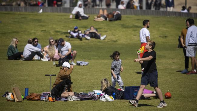 Melburnians enjoying a springtime picnic in the sun in St Kilda. There is no suggestion the people in this picture are linked to anti-lockdown protests. Picture: Paul Jeffers