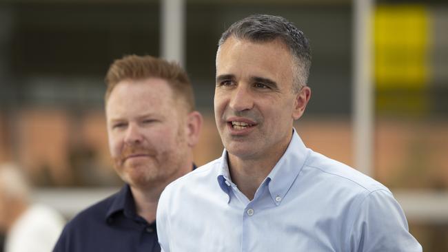 Victorious Labor candidate Alex Dighton with Premier Peter Malinauskas on election day at Woodend Primary School. Picture: Brett Hartwig