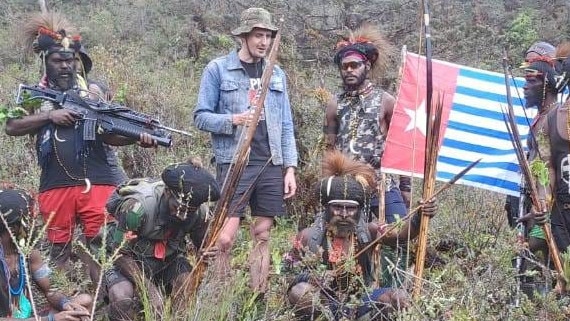 Philip Mehrtens pictured with fighters from the West Papuan National Liberation Army, the armed wing of the Free Papuan Movement, which is calling for independence from Indonesia.