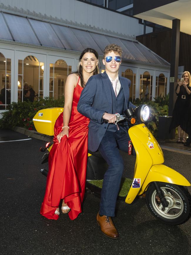 Graduate Grant Eldridge-Hayes and partner Abby Patchett arrive on a moped to the Toowoomba Flexi School formal at Burke and Wills Hotel, Thursday, October 20, 2022. Picture: Kevin Farmer