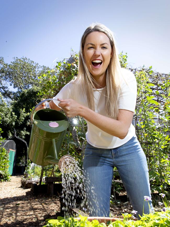 Danielle Lewis poses for a photograph at Jane Street Community Garden in West End, Monday, September 9, 2019 (AAP Image/Richard Walker)