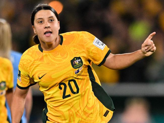 FILES-- This file photo taken on August 16, 2023 shows Australia's forward Sam Kerr celebrating scoring her team's first goal during the Australia and New Zealand 2023 Women's World Cup semi-final football match between Australia and England at Stadium Australia in Sydney. Chelsea and Australian women's football star Sam Kerr has been charged with a "racially aggravated offence" in Britain following a dispute involving a police officer, London's Metropolitan Police said March 4. The 30-year-old striker, one of the highest profile and best-paid players in the women's game, was charged following an incident in London in January 2023, a police statement read. (Photo by IZHAR KHAN / AFP)