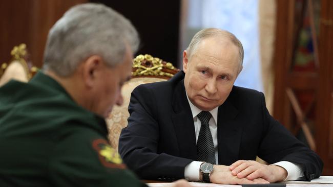 Vladimir Putin with Defence Minister Sergei Shoigu at the Kremlin. Picture: AFP.