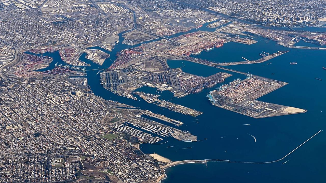 An aerial image taken on October 28, 2021 shows cargo container ships and shipping terminals at the Port of Los Angeles and Port of Long Beach. Picture: Patrick T. FALLON / AFP.